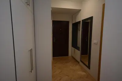an empty hallway with a door and a mirror at Apartman Jocić in Vrnjačka Banja