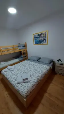a bedroom with a bed with a tray on it at Apartman Kasija in Jagodina