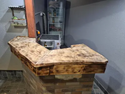 a wooden counter in a kitchen with a refrigerator at Vila Dimitrijevic Lisine in Despotovac