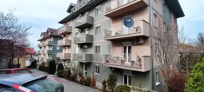 a building with a car parked in front of it at A&A in Vrnjačka Banja