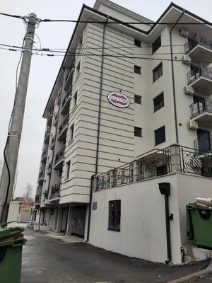 a building with a sign on the side of it at APARTMANI CEPERKOVIC in Vrnjačka Banja