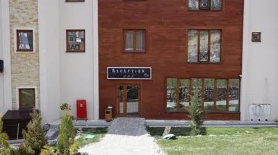 a building with a sign on the front of it at Ctrl Alt Del Apartment S76 in Kopaonik