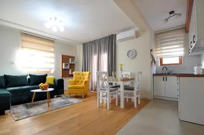 a living room with a couch and a table at Apartman Antic 1 in Vrnjačka Banja