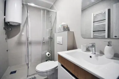 a bathroom with a toilet and a sink and a shower at Apartman Antic 1 in Vrnjačka Banja