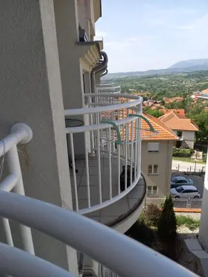 a spiral staircase on the side of a building at Smeštaj Voli - Borići studio-apartman, Sokobanja in Soko Banja