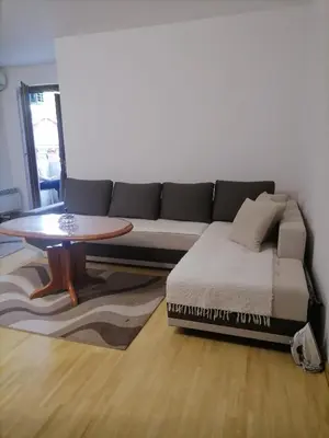 a living room with a couch and a coffee table at Apartman Boki in Vrnjačka Banja