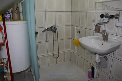 a bathroom with a shower and a sink at Apartman Wisteria in Vranje