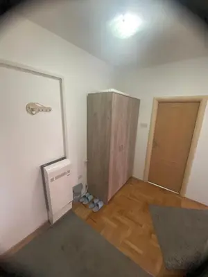 an empty room with a closet and a door at City view & pool apartment in Niš