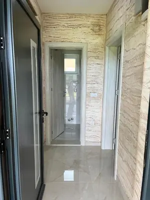 a hallway with a door and a mirror in a room at Djokić 3 sa bazenom in Soko Banja