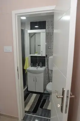 a bathroom with a sink and a toilet at Milivojevic in Soko Banja