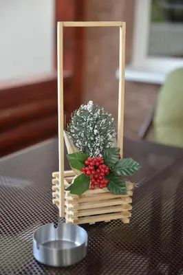 a table topped with a flower arrangement on a table at Milivojevic in Soko Banja