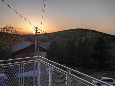 a view of the sunset from the balcony of a house at Apartman IKA Sokobanja in Soko Banja
