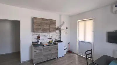 a kitchen with a sink and a counter top at Apartman IKA Sokobanja in Soko Banja