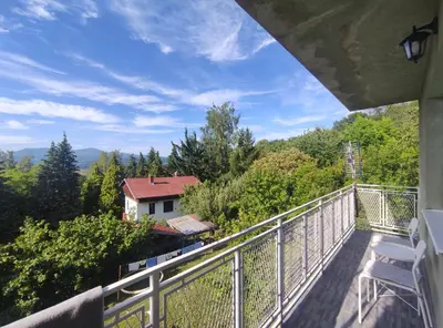 a balcony with a view of a house at Apartman Jorgos in Soko Banja