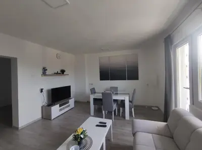 a living room with a couch and a table at Apartman Jorgos in Soko Banja