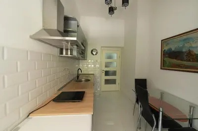 a kitchen with a sink and a counter top at Sleep Hostel in Niš