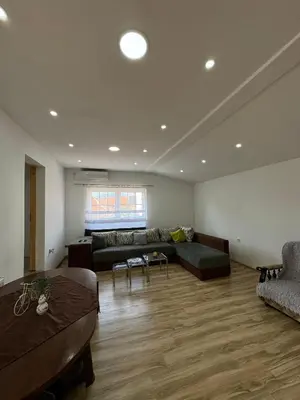 a living room with a couch and a table at Apartman Zigic in Soko Banja