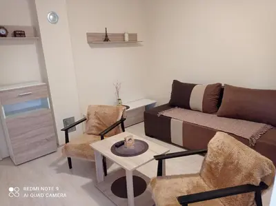 a living room with a couch and chairs and a table at Apartman Aleks in Soko Banja