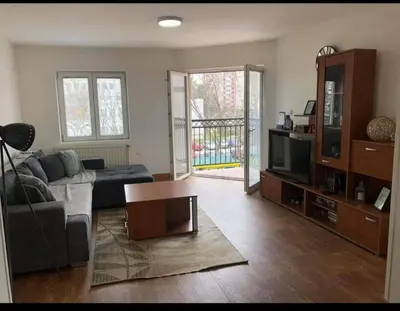 a living room with a couch and a table at Greenspace in Niš