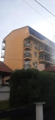 a large building with balconies on the side of it at Greenspace in Niš