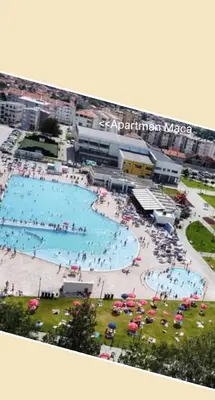 an aerial view of a swimming pool with people in it at Apartman MACA in Pirot