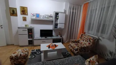 a living room with a couch and a table at Apartman MACA in Pirot