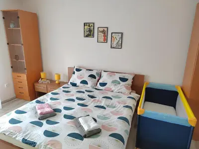 a childs bedroom with a bed with a crib at Apartmani MALINA in Vrnjačka Banja