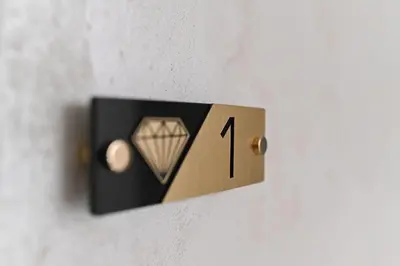 a switch on a wall with a diamond on it at Apartmani Joja in Kuršumlija