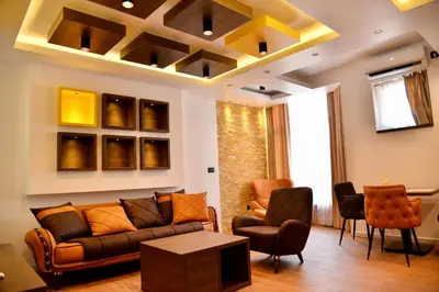 a living room with a couch and chairs at Bella Superior Apartment in Kruševac
