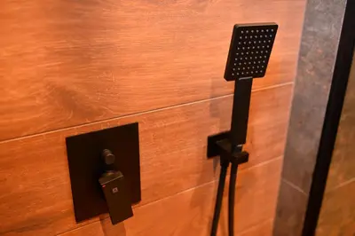 a plugged into a electrical outlet on a wooden floor at Bella Superior Studio in Kruševac