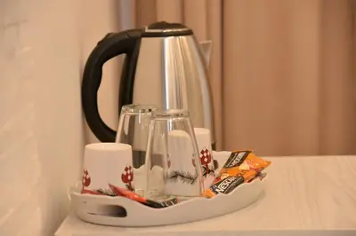 affeepot and cups on a tray on a table at Bella Superior Studio in Kruševac