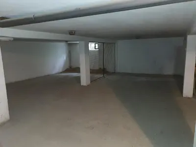 an empty room with a concrete floor at Apartman Lan - Free parking in Vranje