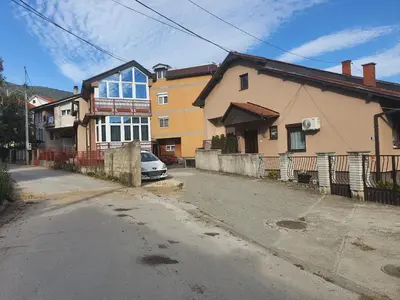 a house with a car parked in front of it at Apartman Lan - Free parking in Vranje