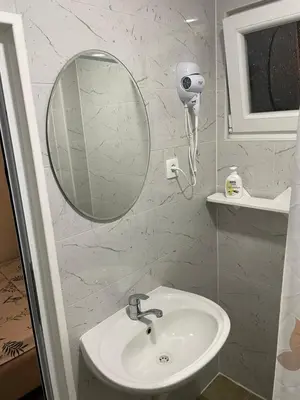 a bathroom with a sink and a mirror at Prenociste 
