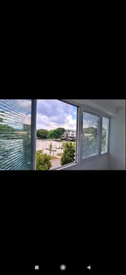 a window in a room with a view of a beach at Apartman Leon Lux in Leskovac