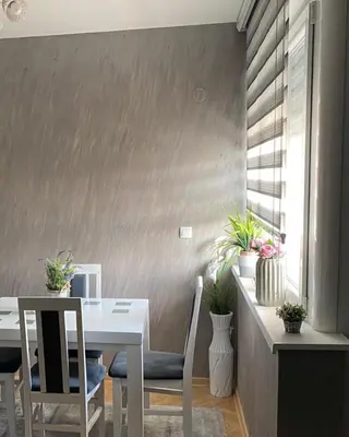 a dining room with a white table and chairs at Dora Lux & Free Indoor Parking in Vrnjačka Banja