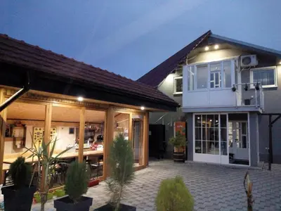 a house with a patio in front of it at Apartman Konak in Zaječar