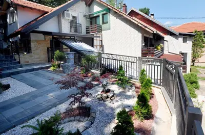 an aerial view of a garden in front of a house at Stil Park Apartmani in Vrnjačka Banja