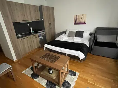 a bedroom with a bed and a table in it at Mountain Story in Brzeće
