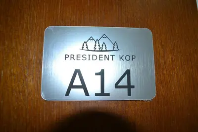 a sign that says persistent kop on a door at President Kop A 14 in Cajetina