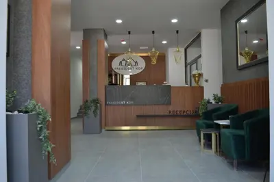 a lobby of a restaurant with a reception desk at President Kop A 14 in Cajetina