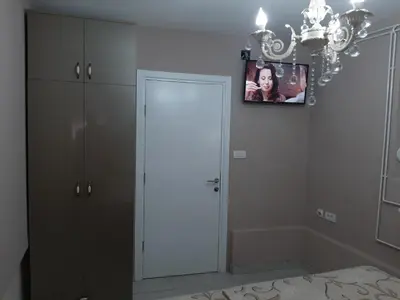 a room with a white door and a picture on the wall at Apartment Sweet dreams 4 in Niš