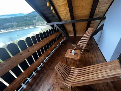 a view from the top of a building with benches at Zavojsko jezero - Vila Jezero in Pirot