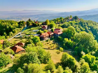 an aerial view of a house on a hill with trees at Country House Sunčev breg in Bara Slatina