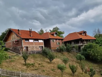 two houses with red roofs on top of a hill at Country House Sunčev breg in Bara Slatina