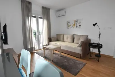 a living room with a couch and a table at Apartman Lipa 11 in Vrnjačka Banja