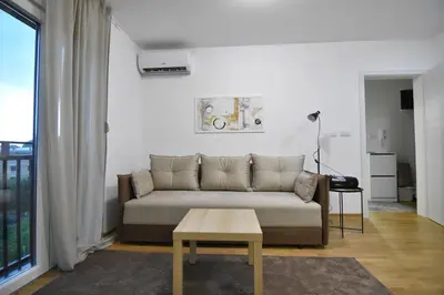 a living room with a couch and a table at Apartman Lipa 11 in Vrnjačka Banja