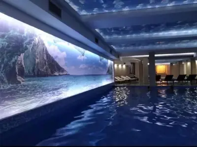 a hotel swimming pool with a view of the ocean at Milmari K13 in Kopaonik