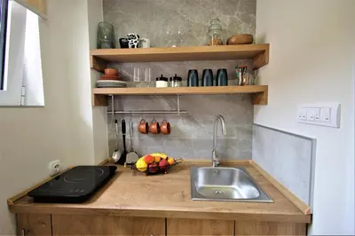 a kitchen with a sink and a counter top at Studio apartman MarMar in Vrnjačka Banja