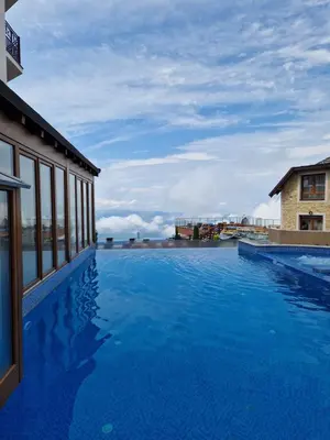 a large swimming pool on the roof of a building at Apartman Sky Milmari L20 in Kopaonik